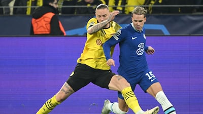 Dortmund midfielder Marius Wolf battles with Mykhailo Mudryk. AFP