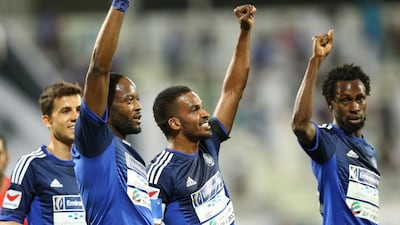 Jires Kembo-Ekoko (left), Mahmoud Khamis (center) and Jonathan Pitroipa (right) of Al Nasr celebrate their win against Al Wasl last season. (Al Ittihad)