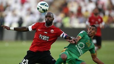 Grafite, left, forces Hassan Ibrahim of Al Shabab off the ball in the President's Cup. Ibrahim signed an extension to remain with Shabab four more years.