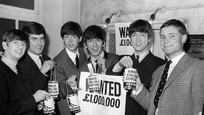 Archer, far right, and Express newspaper editor Nicholas Lloyd with The Beatles in 1963. Getty Images