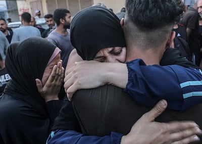 Palestinians mourn during a funeral for their relatives killed in an Israeli airstrike on Al Bureij refugee camp. EPA