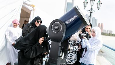 A woman views the Mercury transit during an event hosted by the UAE Space Agency in Abu Dhabi in May, 2016. Reem Mohammed/ The National