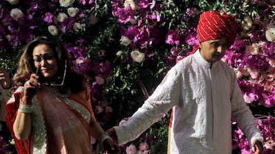Chairman of Reliance Group Anil Ambani and his wife Tina Ambani arrive for the wedding of Akash Ambani, son of Reliance Industries Chairman Mukesh Ambani, in Mumbai, India, Saturday, March 9, 2019. Photo: AP