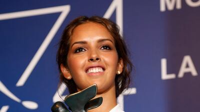 Lyna Khoudri holds the Orizzonti Special Prize for best actress for her role in Les Bienheureux during the awards photo call at the 74th Venice Film Festival. Domenico Stinellis / AP photo