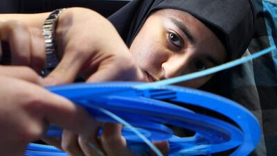 NYU Abu Dhabi engineering students develop their design concepts for a digital communication product with emotional impact for their Design & Innovation class project. Nahil Memon examines a set of laser cut rings for her team’s design concept. Delores Johnson / The National
