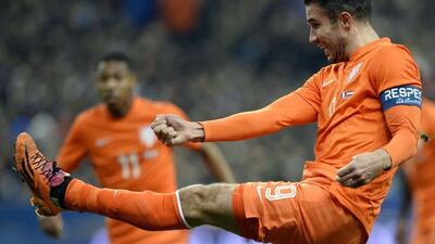 Robin van Persie and Netherlands lost to France 2-0. They'll play in Group B at the 2014 World Cup with Spain, Chile and Australia. Franck Fife / AFP