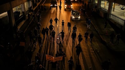 Protesters march as they enter a tunnel a day after a grand jury considering the March killing of Breonna Taylor, a Black medical worker, in her home in Louisville, Kentucky. Reuters
