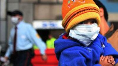 A child at a hospital in Bogota, Colombia, wears a mask as a precaution against swine flu.