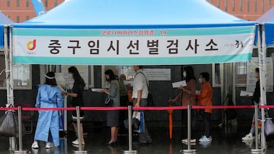 People wait to get tested for coronavirus in Seoul, South Korea. AP