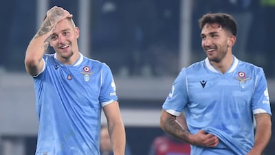 Lazio's Serbian midfielder Sergej Milinkovic-Savic (L) and Lazio's Italian midfielder Danilo Cataldi celebrate. AFP