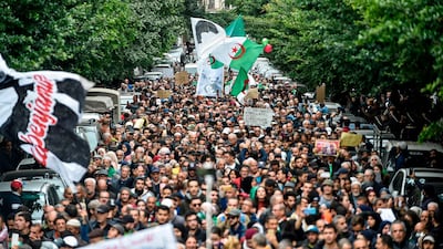 People gather for a mass anti-government demonstration in the centre of the Algerian capital Algiers on December 17, 2019. / AFP / RYAD KRAMDI