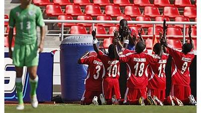 Malawi celebrate after scoring their second goal through Elvis Kafoteka against Algeria in Luanda.