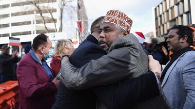 Muslim Association Canterbury President Mohamed Jama celebrates with members of the public outside Christchurch High Court following the sentencing of Brenton Tarrant in Christchurch, New Zealand. Getty Images