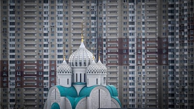 St Nicholas Cathedral stands proud in front of a huge block of apartments on Zhivopisnaya Embankment in Krasnogorsk, Russia. AFP