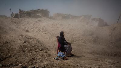 Ivor Prickett: Nadhira Aziz looked on as Iraqi Civil Defence workers dug out the bodies of her sister and niece from her house in the Old City of Mosul, where they were killed by an airstrike in June2017.Iraq,September 2017. From the series:End of the Caliphate, 2016–2018 © Ivor Prickett,The New York Times