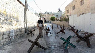 Barricades block a main street at the Jenin refugee camp in the occupied West Bank. EPA