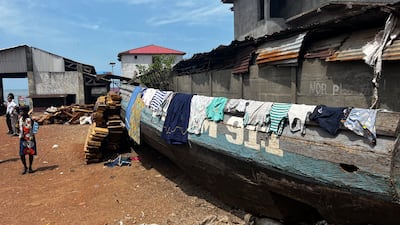 Washing drying on a damaged fishing boat. Nick Webster / The National