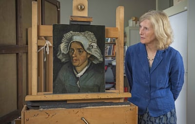 Senior curator Frances Fowle stands with 'Head of a Peasant Woman', which will feature in coming exhibition A Taste for Impressionism at the Royal Scottish Academy, Edinburgh. PA Media