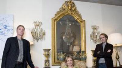 Kevein Weaver, left and his brother Marc and Marc's wife Heather.