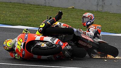 Valentino Rossi, left, and Casey Stoner collide in Jerez during the Spanish MotoGP.