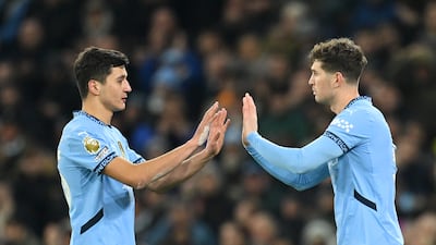Abdukodir Khusanov of Manchester City is substituted off for teammate John Stones. Getty Images