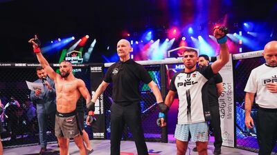 Ali Taleb, left, celebrates his victory over Nawras Abzakh.