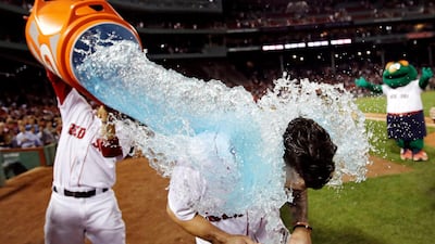 Boston Red Sox's Blake Swihart is doused with sports drink after his walk-off RBI double during the 13th inning of a baseball game at Fenway Park in Boston. Charles Krupa/AP Photo