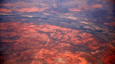 A dirt road and river intersect.