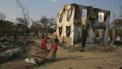 Burmese look to salvage goods among the destruction in Meiktila, where violence between Buddhists and Muslims left 43 people dead and completely destroyed parts of the town.
