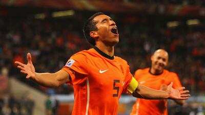Netherlands captain Giovanni Van Bronckhorst celebrates scoring against Uruguay at the 2010 World Cup in South Africa. Getty