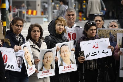 Demonstrators hold posters of Swedish-Iranian doctor and researcher Ahmadreza Jalali who is facing a death sentence in Iran, during a protest to free him, in Stockholm last month. AFP