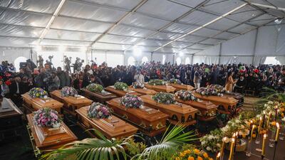 Empty coffins used in a symbolic mass memorial service in East London, South Africa, after 21 people, mostly teenagers, died in a nightclub last month. AFP