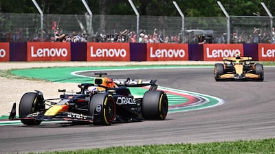 Red Bull Max Verstappen is pursued by McLaren's Lando Norris. AFP
