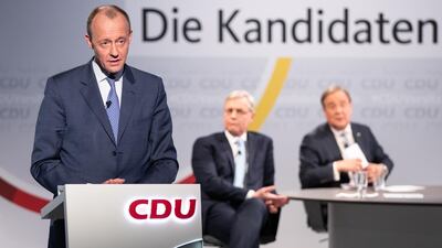 Friedrich Merz speaks while Armin Laschet and Norbert Roettgen watch on during a live-streamed debate at CDU headquarters. Getty Images
