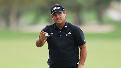 Patrick Reed acknowledges the crowd after winning the Dubai Desert Classic. Getty Images