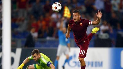AS Roma's Francesco Totti, right, kicks the ball past CSKA Moscow goalkeeper Igor Akinfeev during their Champions League victory on Wednesday night. Tony Gentile / Reuters