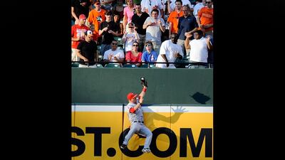 Los Angeles Angels center fielder Mike Trout catches a fly ball by Baltimore Orioles' J.J. Hardy during the first inning of a baseball game on Wednesday, June 27, 2012, in Baltimore. (AP Photo/Nick Wass)