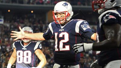 New England Patriots quarterback Tom Brady celebrates a touchdown against the Dallas Cowboys. Larry W Smith / EPA