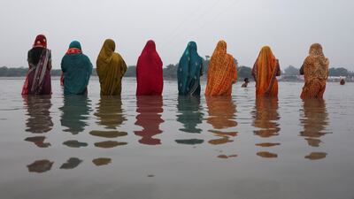 Hindu women worship the Sun god in the waters of the river Yamuna during the Hindu religious festival of Chhath Puja in New Delhi, India. Reuters