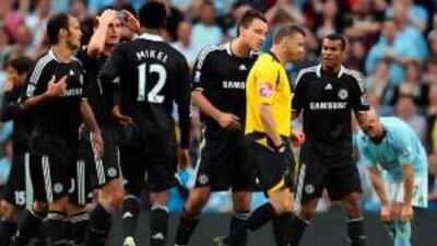 Chelsea's John Terry argues with referee Mark Halsey after being sent off - a decision that has now been changes.