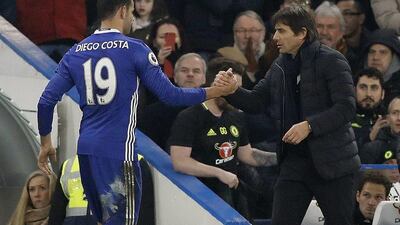 Chelsea manager Antonio Conte, right, shakes hands with Diego Costa after the striker was substituted during the Premier League victory over Hull City on Sunday. Frank Augstein / AP Photo