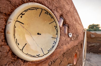 Asuncion Molinos Gordo's Bil Hana wa Al Afia is made of rammed earth with household items embedded in it. Photo: Public Art Abu Dhabi, Department of Culture and Tourism – Abu Dhabi