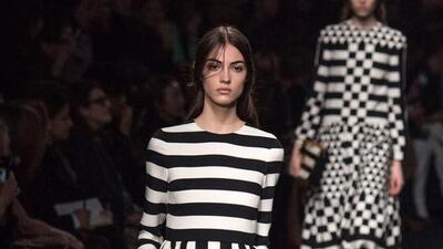 A Valentino model show off a restrained look that would be suitable for wearing during Ramadan.