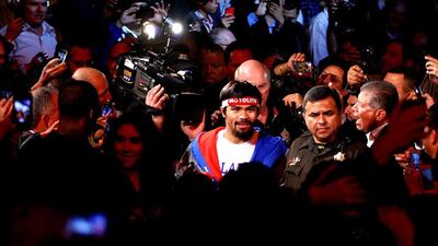 LAS VEGAS, NV - DECEMBER 08: Manny Pacquiao walks to the ring to take on Juan Manuel Marquez during their welterweight bout at the MGM Grand Garden Arena on December 8, 2012 in Las Vegas, Nevada. Al Bello/Getty Images/AFP== FOR NEWSPAPERS, INTERNET, TELCOS & TELEVISION USE ONLY ==