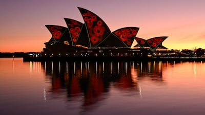 The sails of the Sydney Opera House illuminated with poppies at dawn to mark Remembrance Day in Australia. Reuters