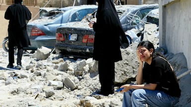 A woman weeps at the site of an Israeli air strike on the southern Lebanese village of Qennarit. AFP