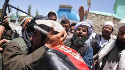 Alleged Taliban militants meets Afghan people as a group of Taliban visits to greet people as a goodwill gesture amid a three-day ceasefire on second day of Eid al-Fitr, in Ghazni, Afghanistan, on June 16, 2018. STR / EPA