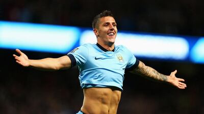 Stevan Jovetic of Manchester City celebrates scoring the second goal during the Premier League match between Manchester City and Liverpool at the Etihad Stadium on August 25, 2014 in Manchester, England. Clive Brunskill/Getty Images