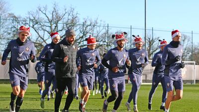Southampton players wear Christmas hats during their training session. Getty