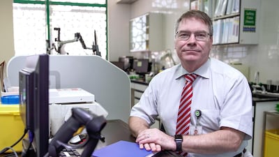 Dr Stephan Weber is awaiting machines which can process Covid-19 test results faster at the National Influenza Centre. Victor Besa / The National